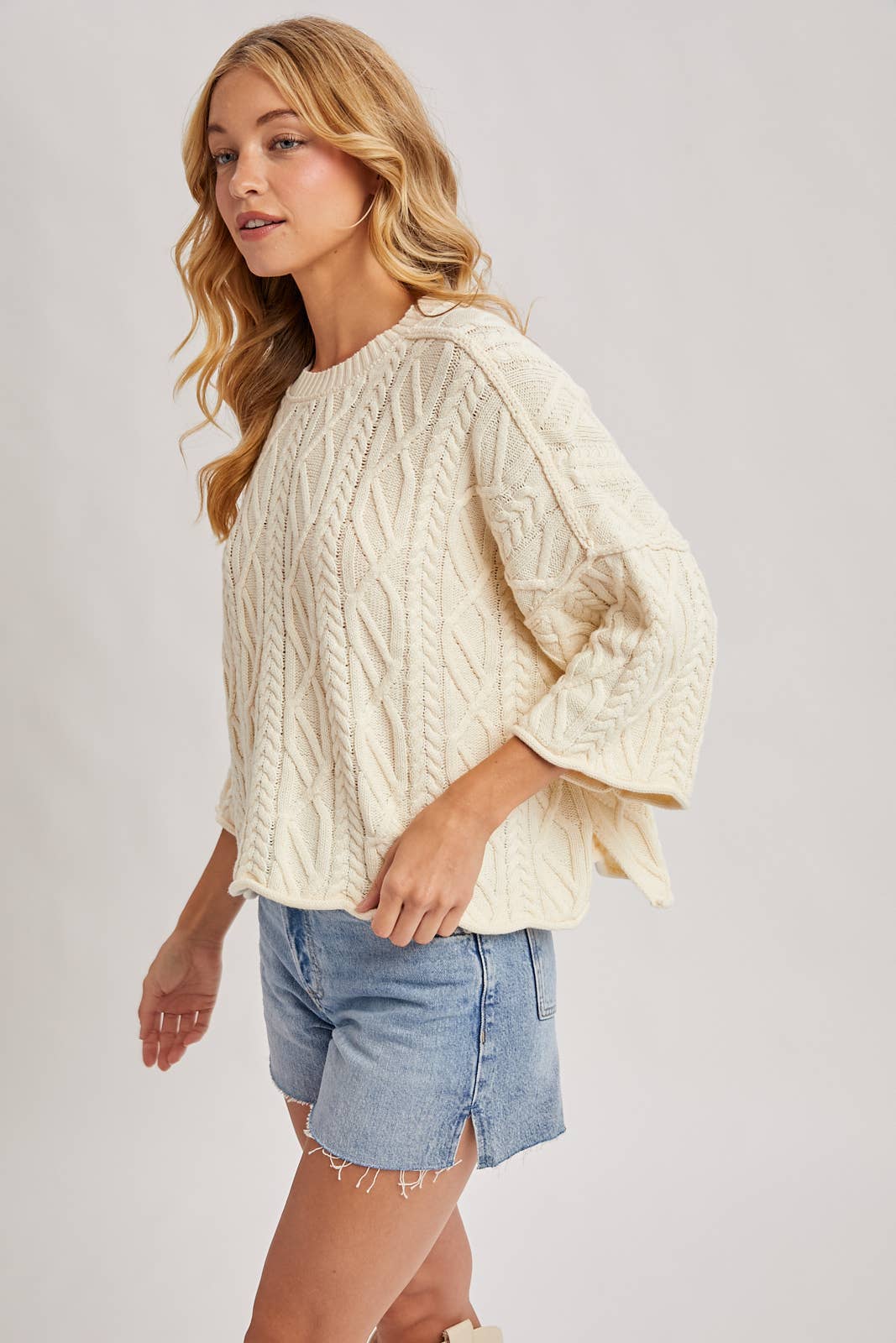 OVERSIZED BELL SLEEVE CABLE KNIT SWEATER: CREAM