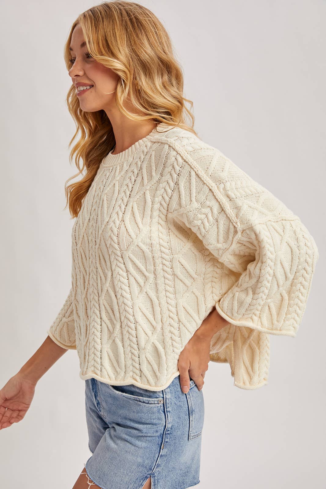 OVERSIZED BELL SLEEVE CABLE KNIT SWEATER: CREAM