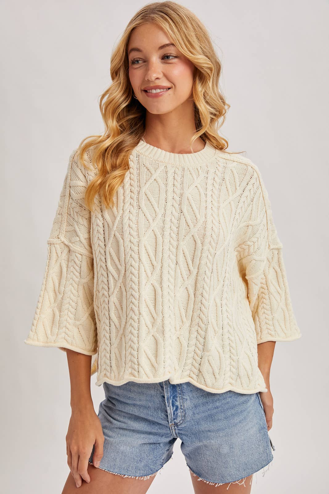 OVERSIZED BELL SLEEVE CABLE KNIT SWEATER: CREAM