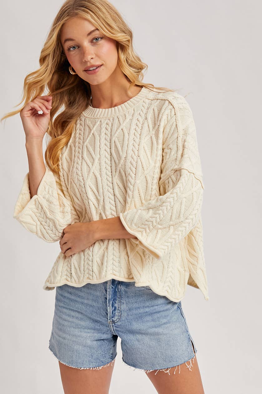 OVERSIZED BELL SLEEVE CABLE KNIT SWEATER: CREAM